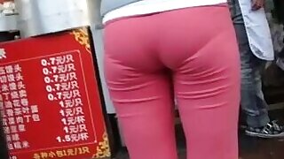 Nice Jap butt in tight pants caught in a street candid video, Lovely Japanese girl in tight pink pants gets caught in this Japanese voyeur street candid video and she looks pretty nice. Her booty is great and looks perfect for anal action.