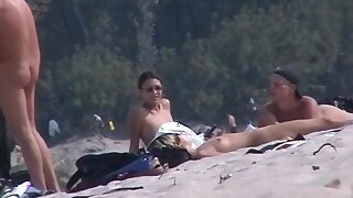only on a nudist beach a voyeur can take lots of shots, Some really amazing bodies of nudist girls are caught and recorded as a hidden beach voyeur gazes at their trimmed pussies