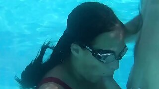 Submerged underwater with a dick inside her